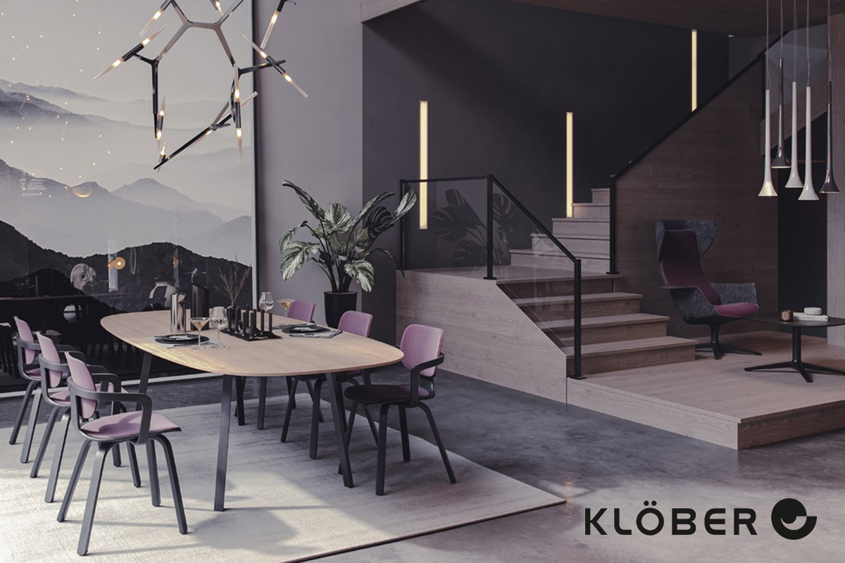 Elegantes Büro mit Klöber CoMeet Recylate Stühlen in Mauve um einen ovalen Tisch arrangiert, mit einem WOOOM Loungestuhl im Hintergrund und einem beeindruckenden Bergpanorama.